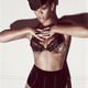 Illustration for article titled emElle/em: Rihannas Waist Gets Whittled Via Photoshop